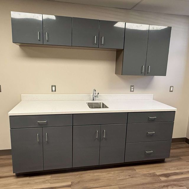 Powder coated steel cabinets installed in an office kitchen, Custom Metal Home
