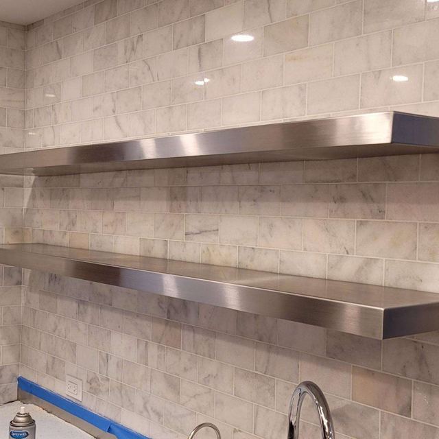 Stainless steel floating shelves on marble tile, Custom Metal Home