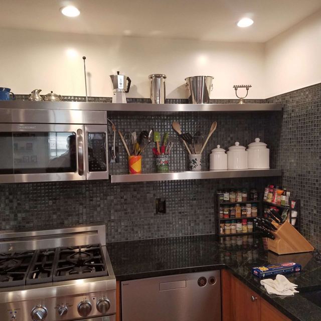 Stainless steel floating shelves in a kitchen, Custom Metal Home