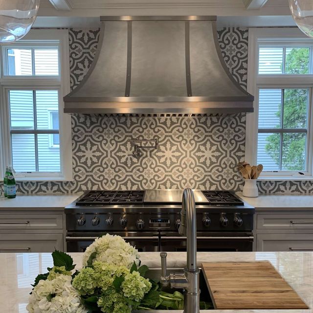 Custom Metal Home range hood. RH-5. Body: Stainless steel matte finish. Straps: Stainless Steel #4 brushed finish