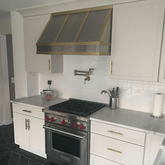 Custom Metal Home range hood. RH-4. Body: Stainless Steel #4 brushed. Straps: Brass with brushed finish