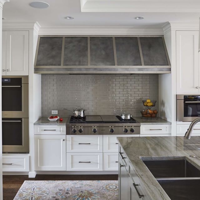 Custom Metal Home range hood. RH-4. Body: Zinc with dark patina. Straps: Stainless with brushed finish