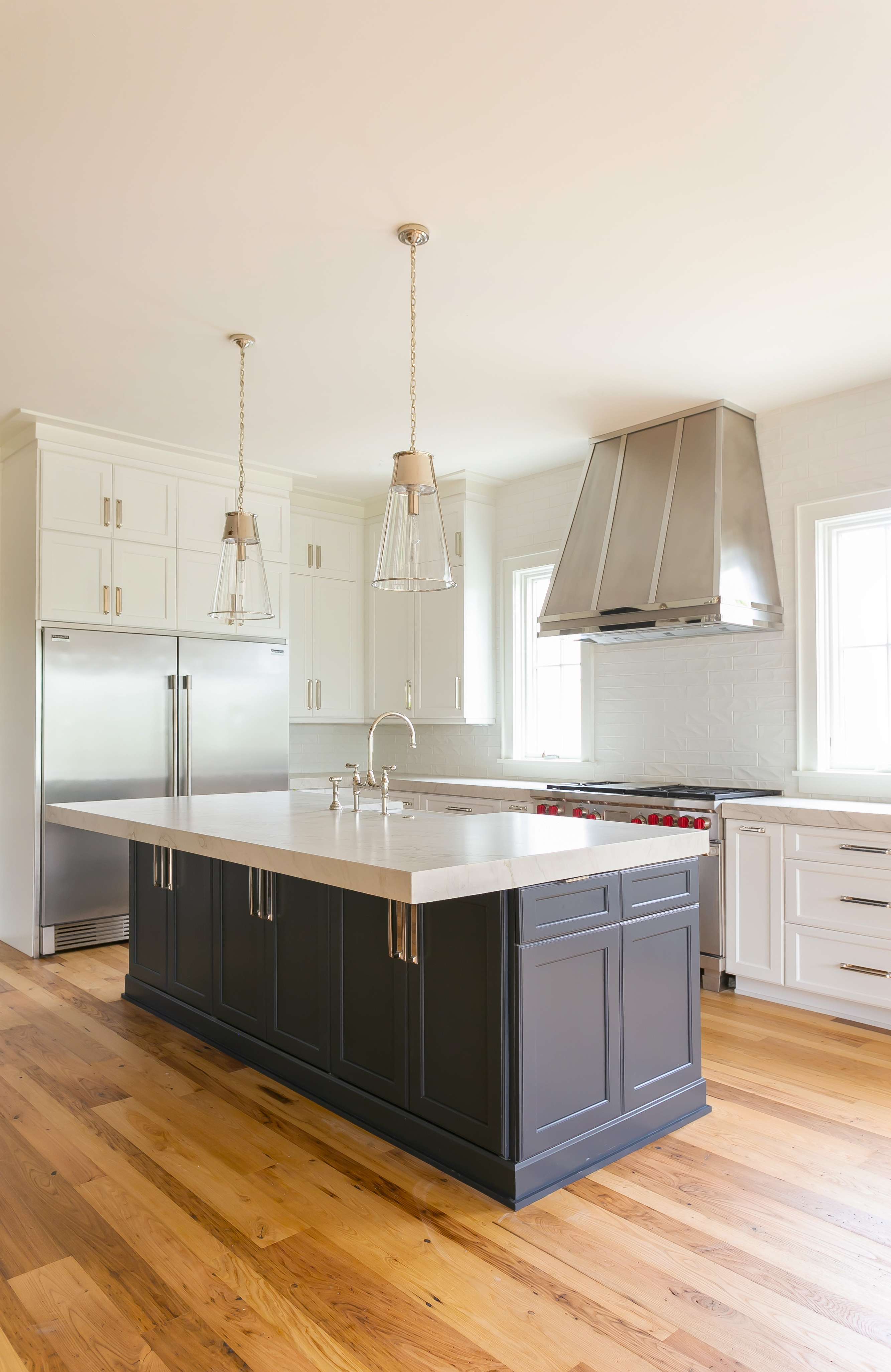 Custom range hood profile detail showing hand-finished stainless steel by Custom Metal Home