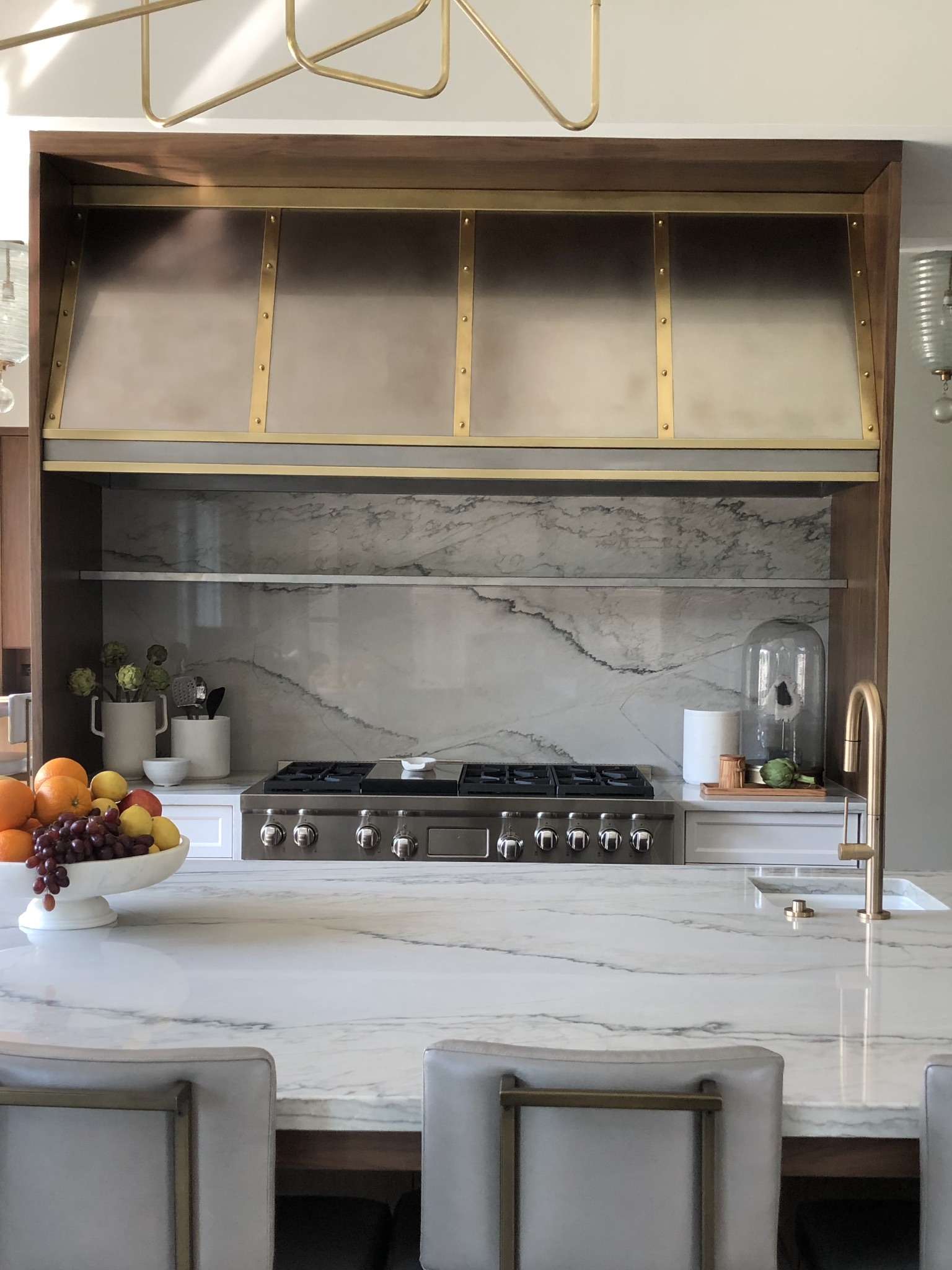 Custom RH-4 range hood in zinc with brass banding, fabricated in Addison IL