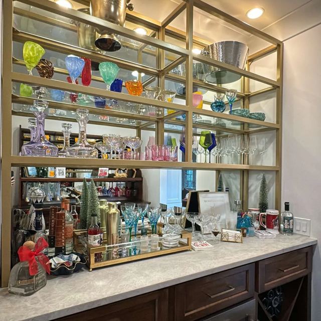 Gold finish shelving unit over a bar, Custom Metal Home
