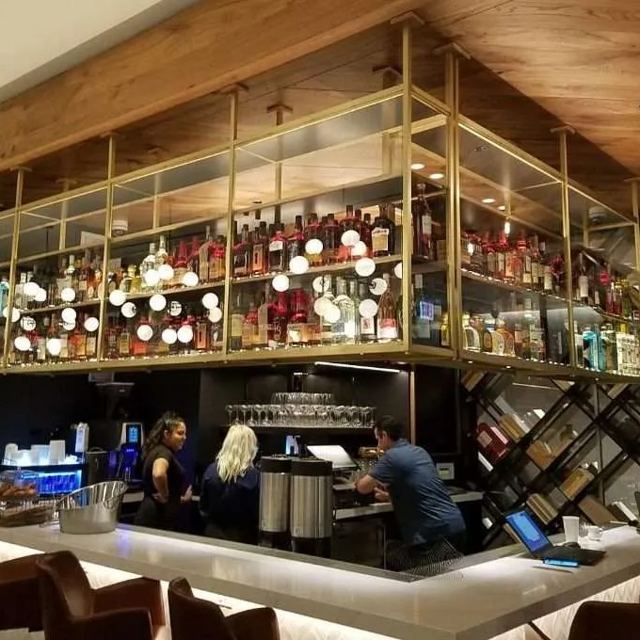 Hanging bottle shelving over a bar, Custom Metal Home