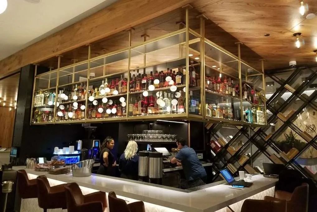 Hanging bottle shelving over a bar