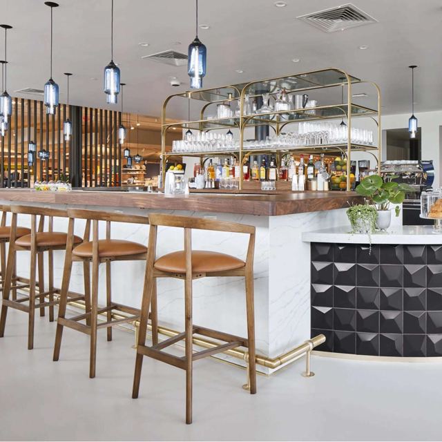 Brass shelving unit over a retail bar, Custom Metal Home