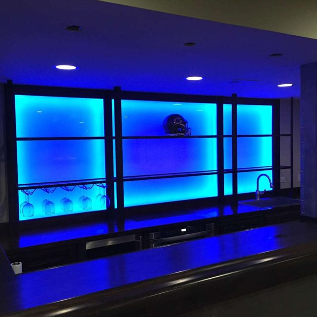 Backlit long shelves behind a bar, Custom Metal Home