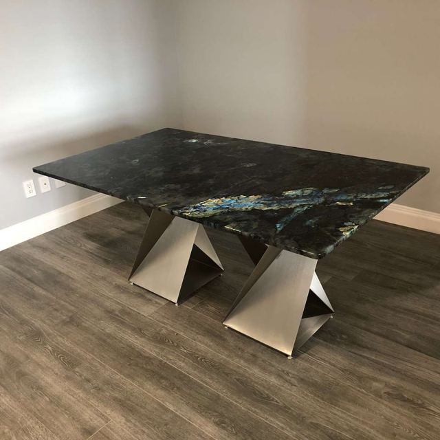 Twist base under a dark stone top, Custom Metal Home