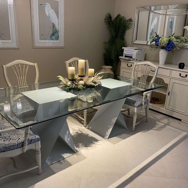 Twist bases under a glass dining top, Custom Metal Home