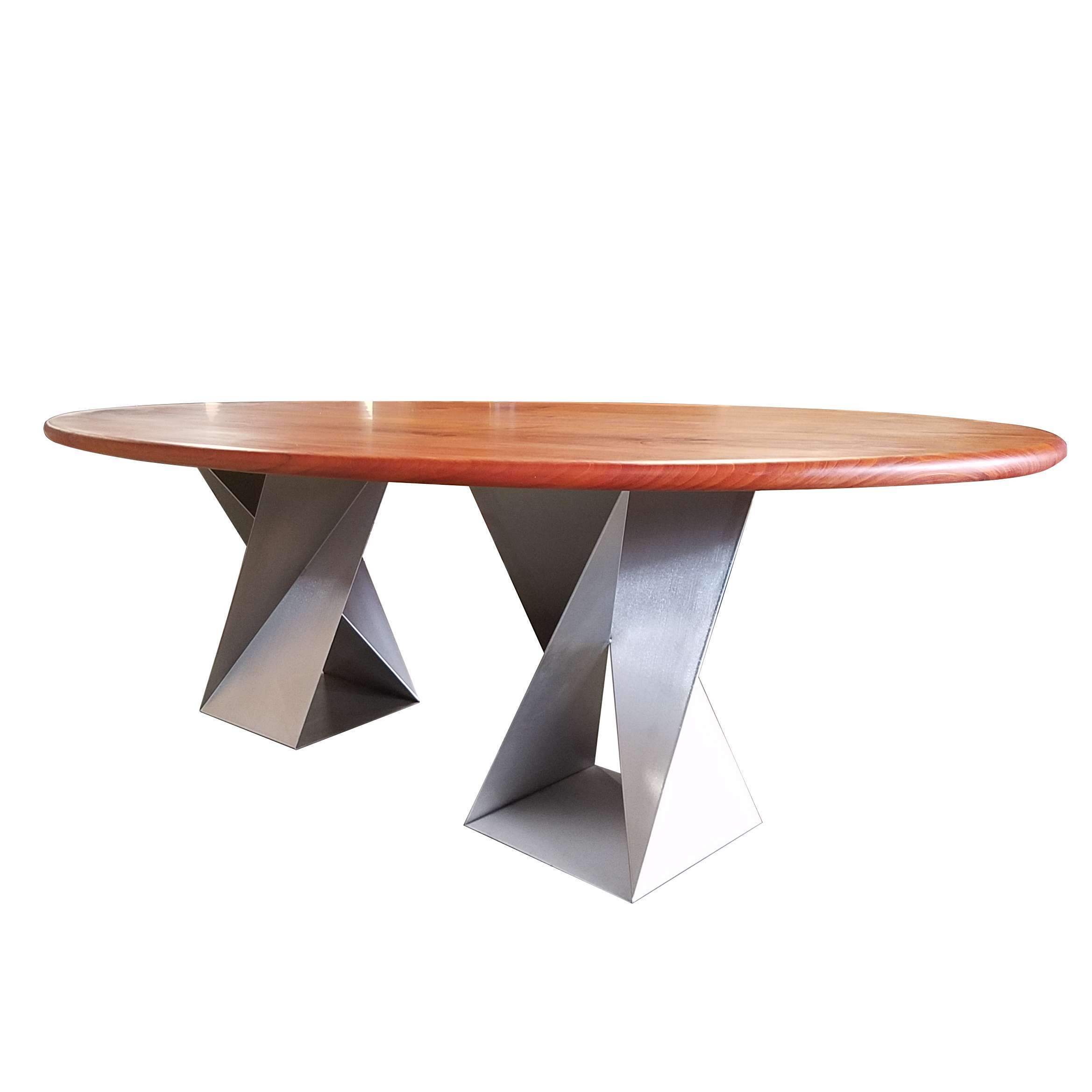 Signature Twist Bases supporting an oval wood dining top by Custom Metal Home