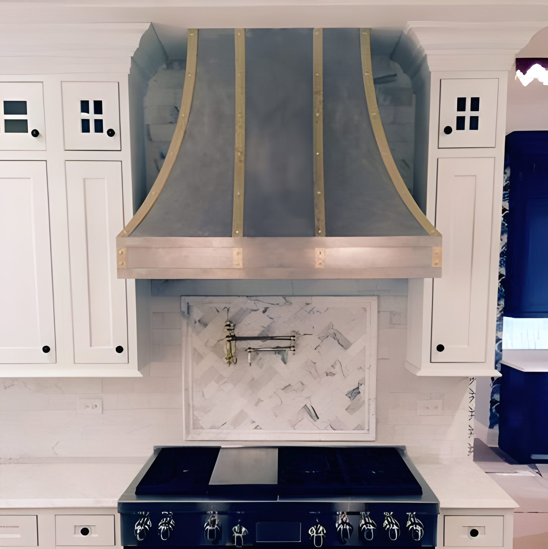 Custom zinc range hood with brass banding fabricated in Addison IL