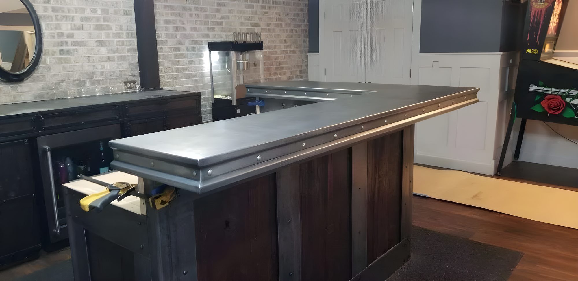 Detail of a zinc bar top with rivet edge by Custom Metal Home